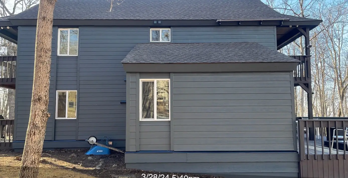 A house with new blue siding and white trim