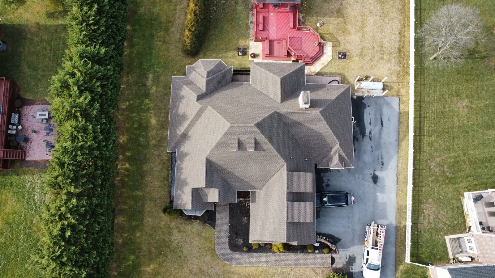 A complex gray hip roof seen from straight above