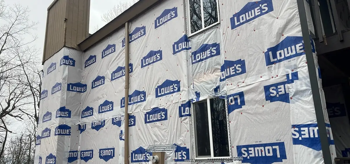 A house wrapped in house wrap before its new siding goes on