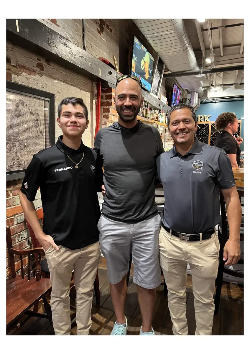 Fernando Sagastume with two men at an On the Road Collaborative event
